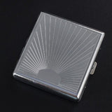 Sunburst engraved metal cigarette case with silver finish on black background