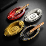 Four color variants of oval resin cigar ashtray in black, white, gold, and red