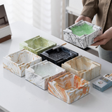 Square marble pattern ashtray styled on a table for everyday smoking use