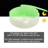 Glow-in-the-dark white silicone ashtray with lid shown in low light