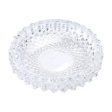 Clear round glass ashtray with diamond pattern on white background