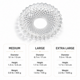 Crystal clear ashtray with size comparison chart on a white background