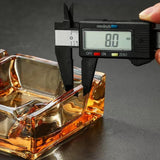 Digital caliper measuring amber square glass ashtray thickness