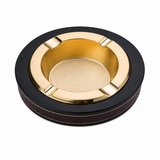 Gold and black round ashtray for cigarettes and cigars