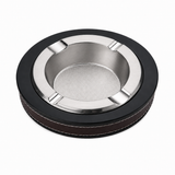 Round metal ashtray with silver tray black rim and leather cover
