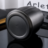 Close-up of the stable base of a black stainless steel ashtray