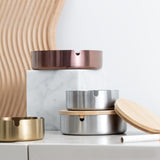 Minimalist stainless steel ashtray with lid in gold silver and rose finishes for indoor outdoor use