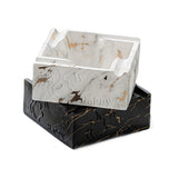 Stacked square ceramic marble pattern ashtrays in white and black finishes