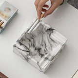 Square ceramic marble pattern ashtray with cigarette rests for clean tabletop use