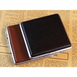 Black and brown cigarette cases closed on paper surface