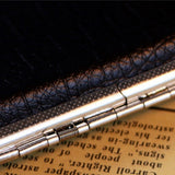 Close-up of cigarette case hinge and metal frame