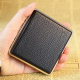Hand holding black PU leather cigarette case