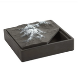 Open cement ashtray showing inner basin with snow mountain lid removed