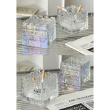 Collage of geometric glass ashtrays in clear and iridescent finishes