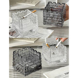Clear and smoked glass ashtrays shown in multiple lifestyle angles