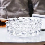 Clear crystal glass ashtray on a table, elegant heavy ashtray for indoor smoking setup