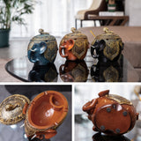Decorative elephant resin ashtray variants in brown and blue with covered lid
