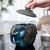 Elephant ashtray with removable lid being opened for indoor or outdoor use