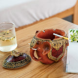 Elephant resin ashtray with lid used on coffee table for smoking area