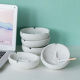 Set of white ceramic face expression ashtrays, modern minimalist decor display
