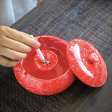 red ceramic ashtray with lid windproof cigarette ashtray in use demonstration