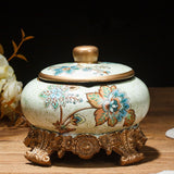 Ivory floral ceramic ashtray with lid and ornate bronze base for vintage home decor