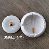 Small white speckled ceramic ashtray open with its lid beside it and 4.7-inch size label