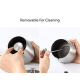 Removable middle pedestal being taken out of a stainless steel ashtray for cleaning
