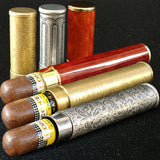 Travel cigar tubes with cigars in gold, red, and silver finishes