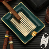 Angled top view of teal ceramic cigar ashtray with cigar
