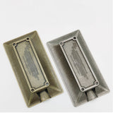 Bottom part of bronze and silver rectangular metal cigar ashtrays