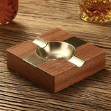 Wood and metal cigar ashtray on wooden table with refined square design