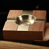 Square cigar ashtray with dark wood base and polished metal ash bowl