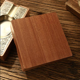 Wood and metal cigar ashtray showing smooth wooden underside and square shape