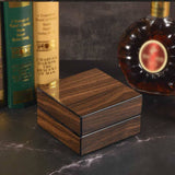 Closed walnut cigar gift box on tabletop
