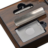 Close-up of stainless steel cigar cutter compartment inside walnut travel box