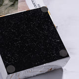Bottom view of square ashtray with anti-slip pads for table surface protection