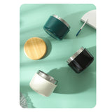 Teal, white, and black covered ashtrays with removable lids for modern outdoor decor