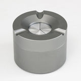 Top view of outdoor ashtray with rotatable lid in closed position
