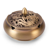 Vintage copper ashtray with ornate carved lid, angled product view