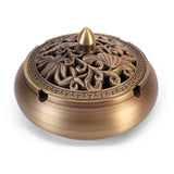 Antique-style copper ashtray with ornate pierced lid, alternate angle view