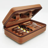 Tan leather humidor case opened with cigars stored inside