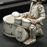 Angled close-up of skull drummer ashtray front detail