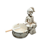 Skull drummer resin ashtray on white background