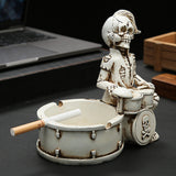 Front angled view of skull drummer ashtray on tabletop