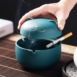 Teal cat ashtray with removable lid and inner cigarette grooves