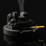 Round cityscape cement ashtray with cigarette