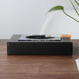 glass ashtray with leather base on wooden table lifestyle view
